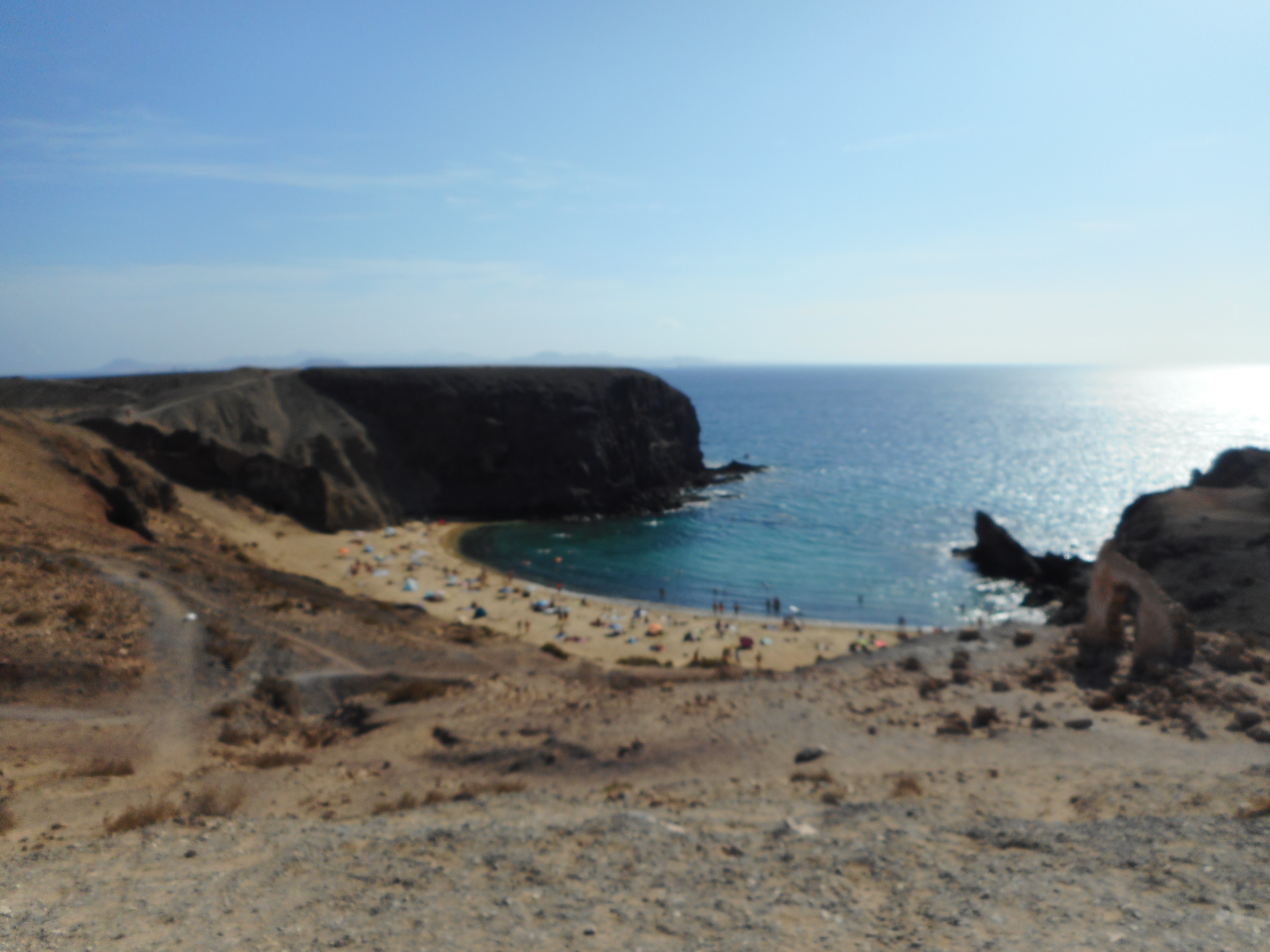 Caletón de San Marcial beach in Lanzarote, featuring a sandy shoreline with calm water conditions